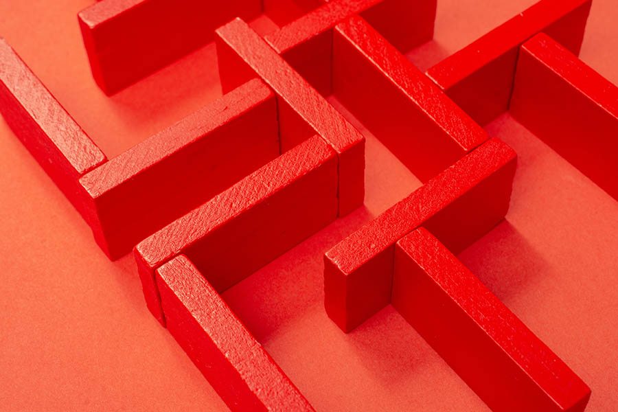 The concept of a business strategy, analytics, search for solutions. Labyrinth of colorful wooden blocks.